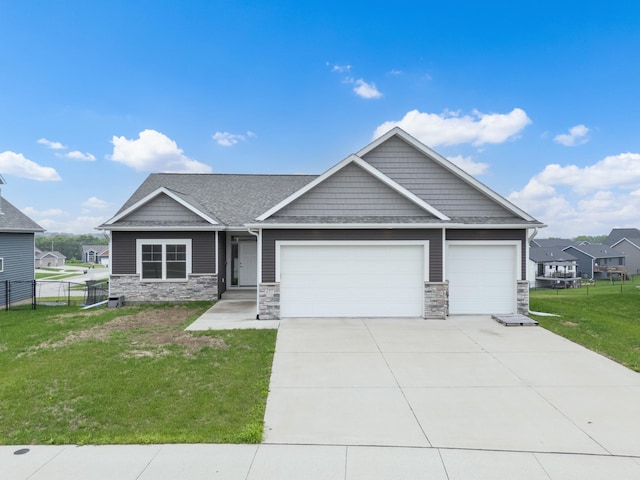 837 Towne Dr NE, Byron, MN 55920 - craftsman house with an attached garage, stone siding, concrete driveway, and a shingled roof