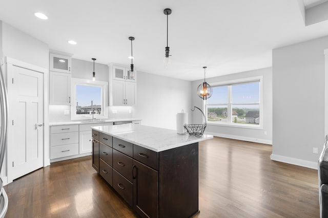 837 Towne Dr NE, Byron, MN 55920 - kitchen featuring white cabinets, dark wood-type flooring, recessed lighting, glass insert cabinets, and a center island