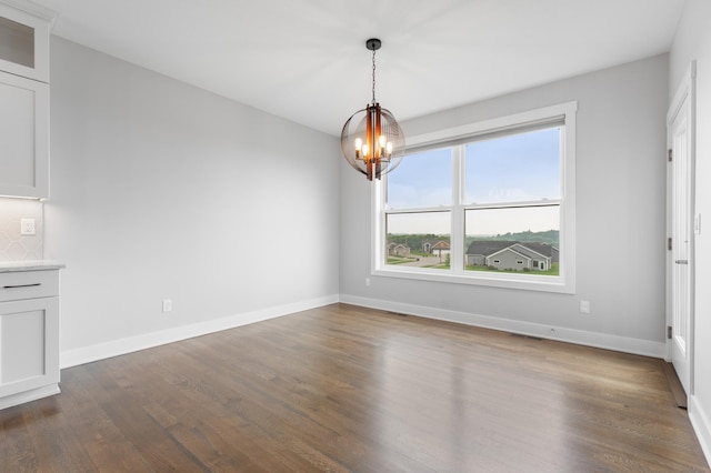 837 Towne Dr NE, Byron, MN 55920 - unfurnished dining area with dark wood finished floors and a chandelier