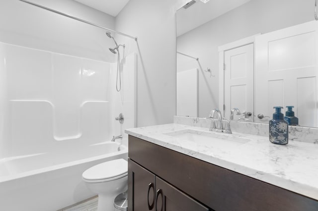 837 Towne Dr NE, Byron, MN 55920 - full bath featuring vanity, shower / bath combination, and wood finished floors