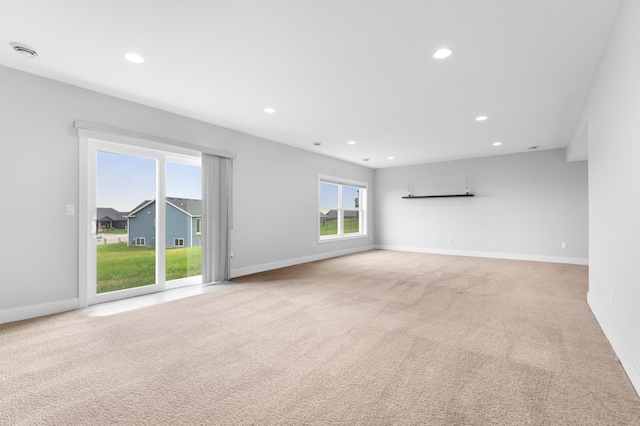 837 Towne Dr NE, Byron, MN 55920 - unfurnished living room featuring light carpet and recessed lighting
