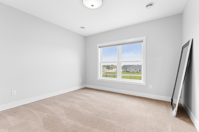 837 Towne Dr NE, Byron, MN 55920 - spare room featuring carpet flooring and baseboards