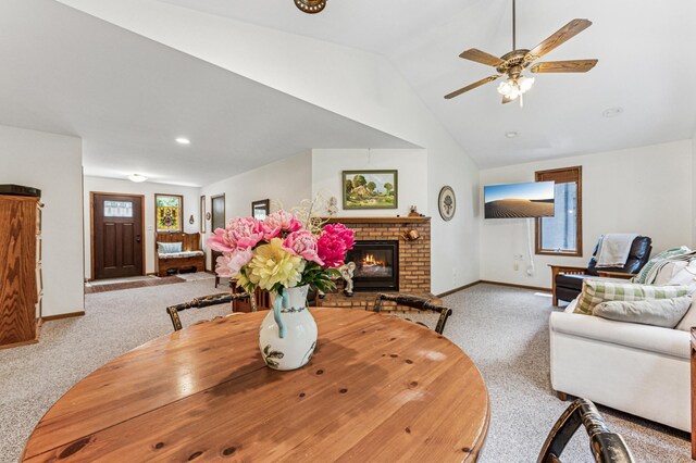 3703 Beard Ave N, Robbinsdale, MN 55422 - carpeted dining area with a fireplace, ceiling fan, vaulted ceiling, and recessed lighting