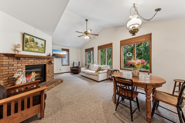 3703 Beard Ave N, Robbinsdale, MN 55422 - dining room featuring lofted ceiling, carpet, a fireplace, and a ceiling fan