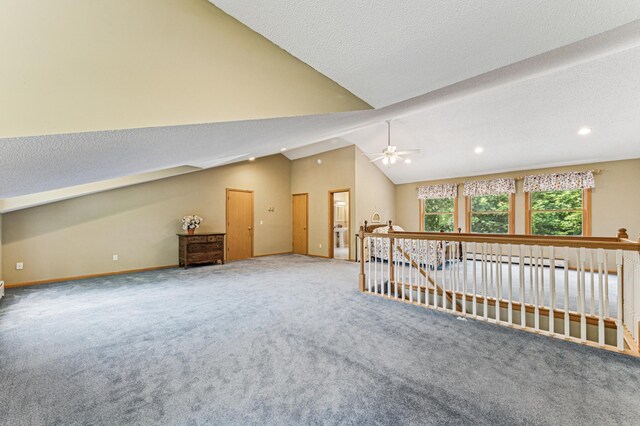 3703 Beard Ave N, Robbinsdale, MN 55422 - carpeted empty room with vaulted ceiling, a ceiling fan, recessed lighting, a baseboard heating unit, and a textured ceiling