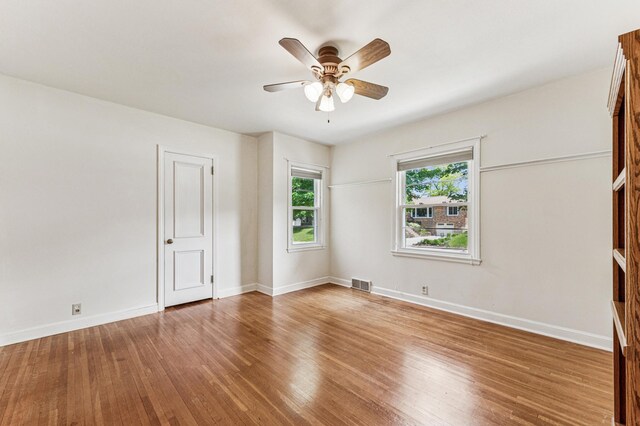 3703 Beard Ave N, Robbinsdale, MN 55422 - unfurnished bedroom with wood finished floors and a ceiling fan