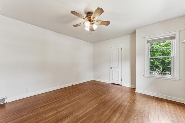 3703 Beard Ave N, Robbinsdale, MN 55422 - empty room with wood finished floors and a ceiling fan