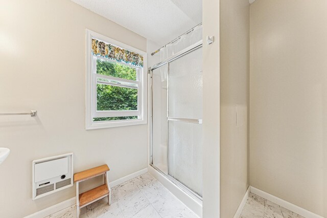 3703 Beard Ave N, Robbinsdale, MN 55422 - bathroom featuring marble finish floors and a stall shower