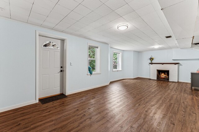 3703 Beard Ave N, Robbinsdale, MN 55422 - unfurnished living room featuring dark wood finished floors and a brick fireplace
