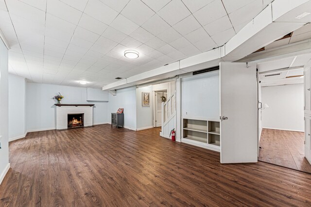 3703 Beard Ave N, Robbinsdale, MN 55422 - finished basement featuring wood finished floors, a brick fireplace, and stairs