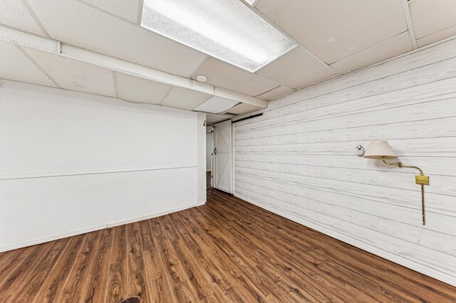 3703 Beard Ave N, Robbinsdale, MN 55422 - finished below grade area featuring wooden walls, wood finished floors, and a paneled ceiling