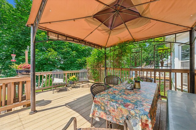 3703 Beard Ave N, Robbinsdale, MN 55422 - wooden deck featuring outdoor dining space