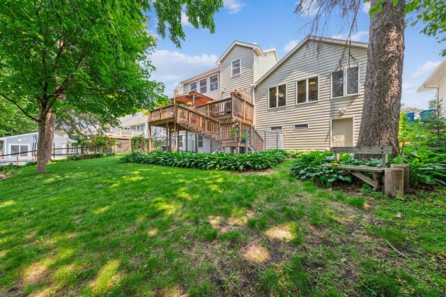 3703 Beard Ave N, Robbinsdale, MN 55422 - back of house featuring a wooden deck and stairs