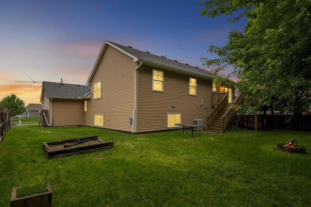 527 1st Ave NE, Lonsdale, MN 55046 - back of property featuring a garden, stairway, and an outdoor fire pit
