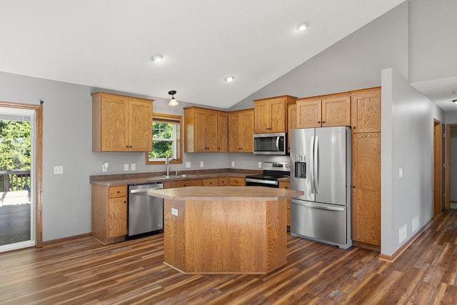 527 1st Ave NE, Lonsdale, MN 55046 - kitchen featuring stainless steel appliances, dark wood finished floors, vaulted ceiling, a center island, and recessed lighting