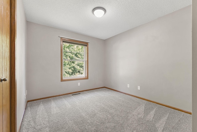 527 1st Ave NE, Lonsdale, MN 55046 - carpeted spare room with a textured ceiling and baseboards