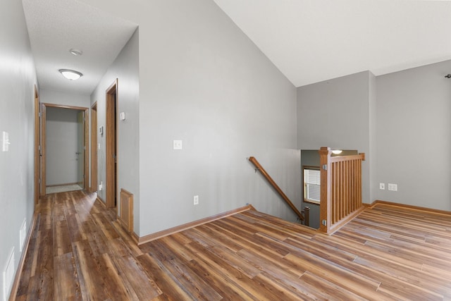527 1st Ave NE, Lonsdale, MN 55046 - hall featuring an upstairs landing, wood finished floors, and lofted ceiling