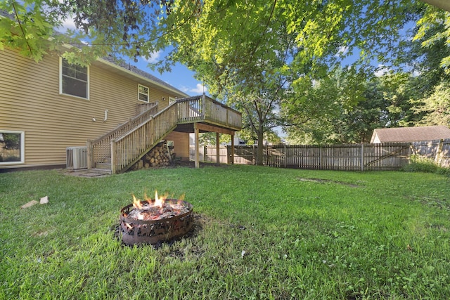 527 1st Ave NE, Lonsdale, MN 55046 - fenced backyard featuring stairs, an outdoor fire pit, and a wooden deck