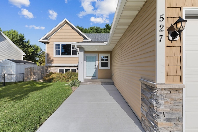 527 1st Ave NE, Lonsdale, MN 55046 - doorway to property featuring a shingled roof and stone siding