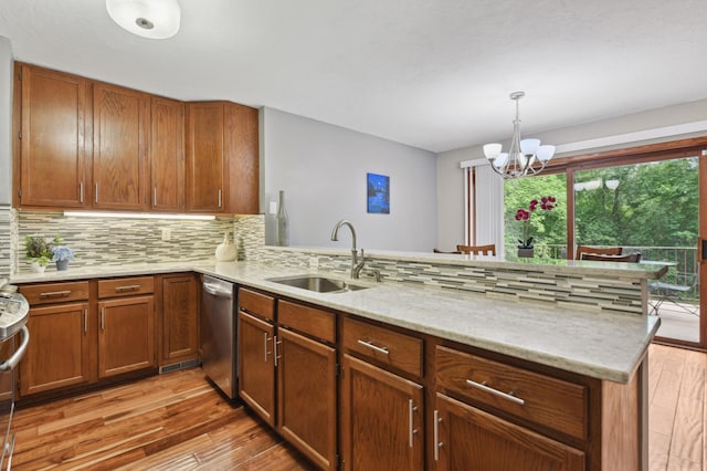 1398 Summit Cir W, Saint Paul, MN 55118 - kitchen with dishwasher, light wood finished floors, tasteful backsplash, a peninsula, and a chandelier