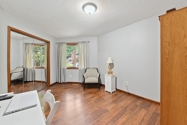 1398 Summit Cir W, Saint Paul, MN 55118 - sitting room featuring a textured ceiling and wood finished floors