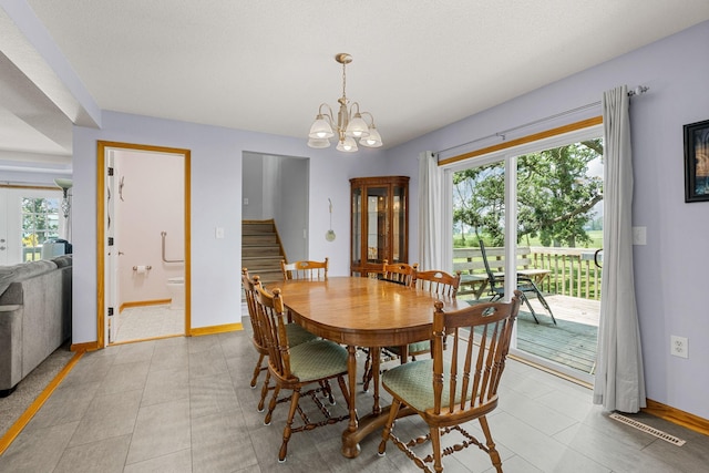 4193 Austin Rd, Owatonna, MN 55060 - dining room featuring stairway, plenty of natural light, a chandelier, and light tile patterned flooring