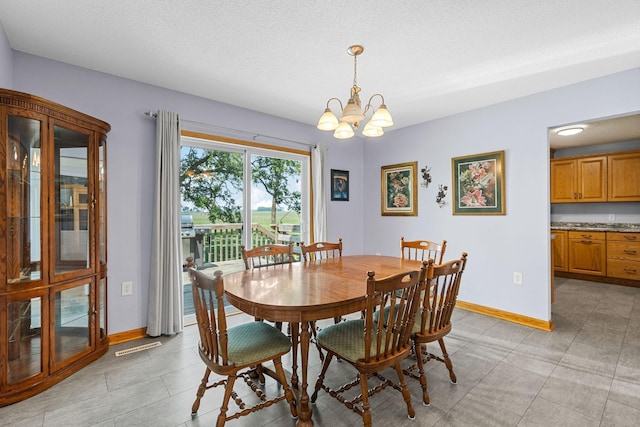 4193 Austin Rd, Owatonna, MN 55060 - dining area featuring a chandelier and baseboards