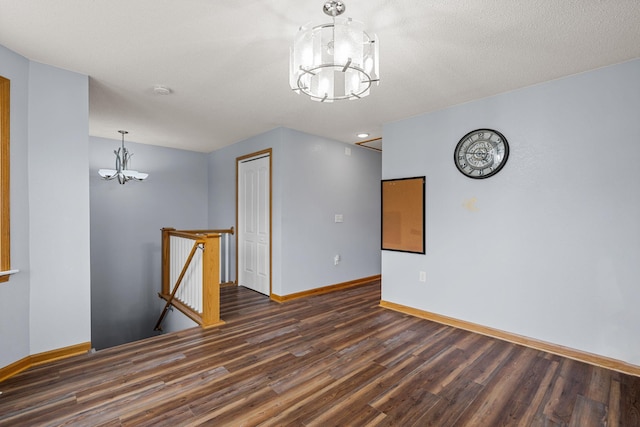 4193 Austin Rd, Owatonna, MN 55060 - spare room with a chandelier and wood finished floors