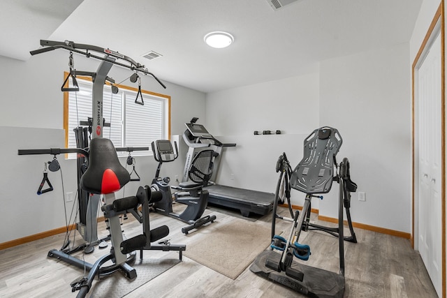 4193 Austin Rd, Owatonna, MN 55060 - exercise room featuring wood finished floors and baseboards