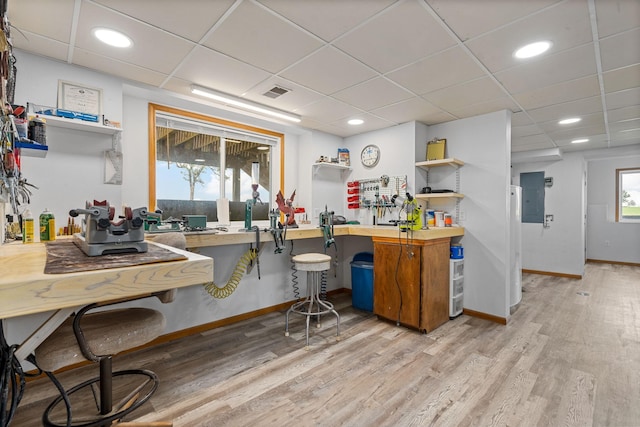 4193 Austin Rd, Owatonna, MN 55060 - kitchen with a drop ceiling, electric panel, light wood finished floors, open shelves, and butcher block countertops