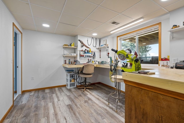 4193 Austin Rd, Owatonna, MN 55060 - home office featuring a paneled ceiling, wood finished floors, a workshop area, and recessed lighting
