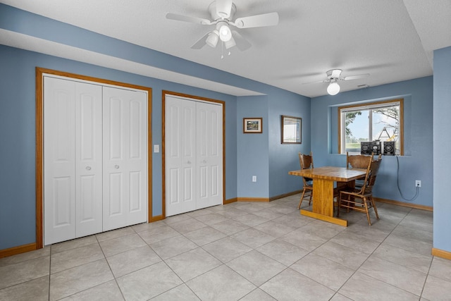 4193 Austin Rd, Owatonna, MN 55060 - dining room with ceiling fan, a textured ceiling, and light tile patterned flooring