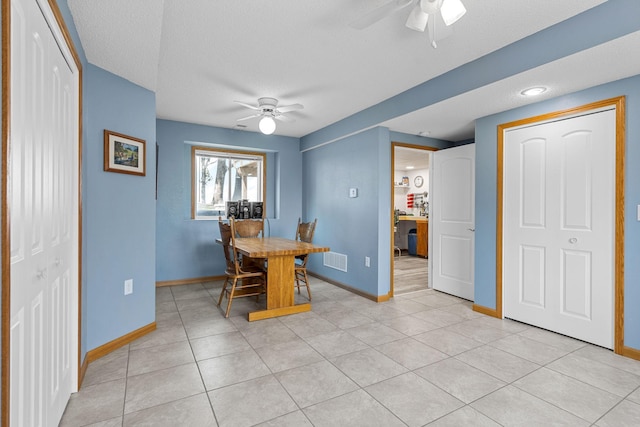 4193 Austin Rd, Owatonna, MN 55060 - dining area featuring ceiling fan, light tile patterned floors, and a textured ceiling