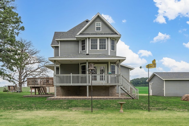 4193 Austin Rd, Owatonna, MN 55060 - back of property featuring stairs, a wooden deck, and a lawn