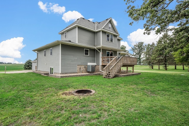 4193 Austin Rd, Owatonna, MN 55060 - back of property featuring a wooden deck, stairway, and a yard