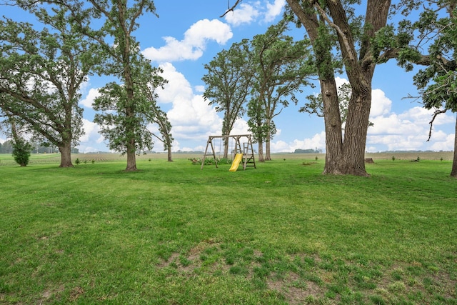 4193 Austin Rd, Owatonna, MN 55060 - view of green lawn with a playground