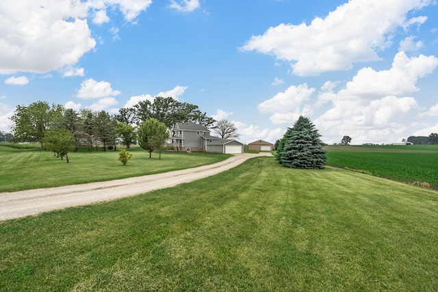 4193 Austin Rd, Owatonna, MN 55060 - view of home's community with a yard and a detached garage