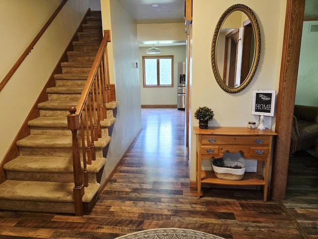 2607 4th Ave NW, Austin, MN 55912 - stairway featuring wood finished floors and baseboards