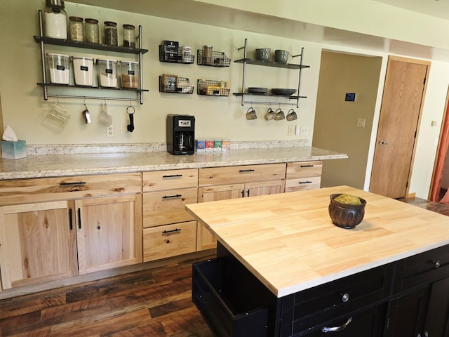 2607 4th Ave NW, Austin, MN 55912 - kitchen featuring light brown cabinets, butcher block countertops, open shelves, dark cabinetry, and a kitchen island