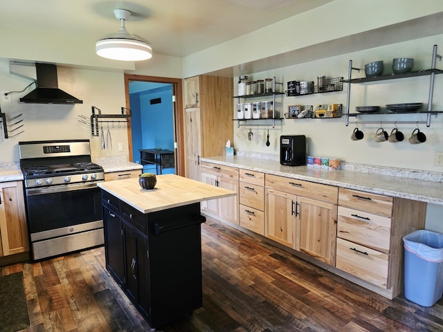 2607 4th Ave NW, Austin, MN 55912 - kitchen featuring gas range, wall chimney range hood, dark cabinetry, wooden counters, and open shelves