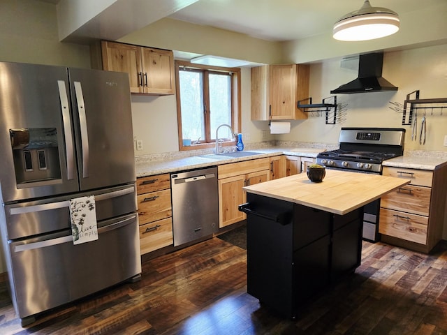 2607 4th Ave NW, Austin, MN 55912 - kitchen featuring stainless steel appliances, wall chimney exhaust hood, butcher block counters, light brown cabinetry, and dark wood-style floors
