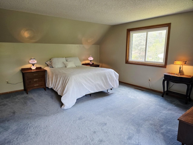 2607 4th Ave NW, Austin, MN 55912 - bedroom with carpet floors, a textured ceiling, and vaulted ceiling