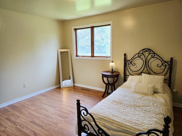 2607 4th Ave NW, Austin, MN 55912 - bedroom featuring wood finished floors and baseboards