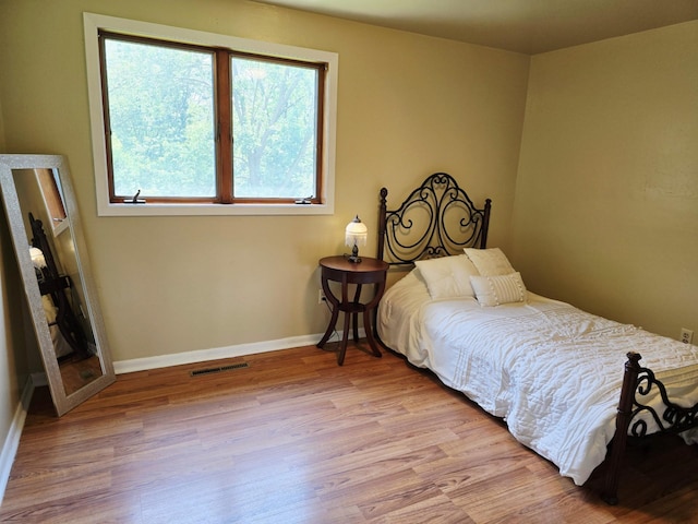 2607 4th Ave NW, Austin, MN 55912 - bedroom with wood finished floors and baseboards