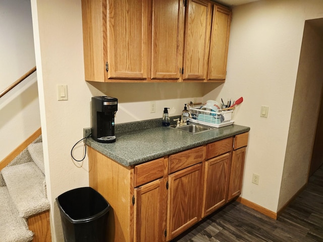 2607 4th Ave NW, Austin, MN 55912 - kitchen featuring dark wood-style floors, dark countertops, and brown cabinets