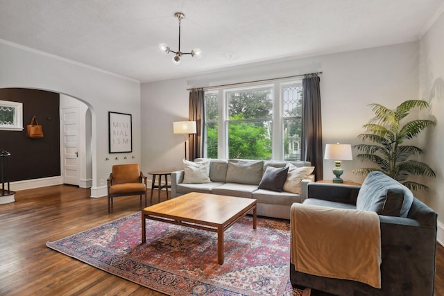 4210 Blaisdell Ave, Minneapolis, MN 55409 - living room featuring arched walkways, wood finished floors, ornamental molding, and a chandelier