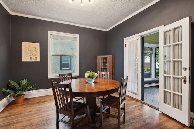 4210 Blaisdell Ave, Minneapolis, MN 55409 - dining space featuring wood finished floors, a textured ceiling, ornamental molding, and french doors
