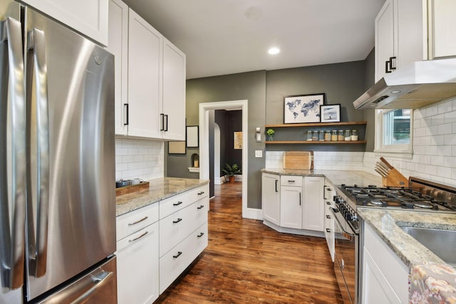 4210 Blaisdell Ave, Minneapolis, MN 55409 - kitchen with stainless steel appliances, under cabinet range hood, open shelves, dark wood-type flooring, and tasteful backsplash