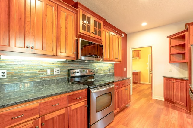 10725 Toledo Ln N, Brooklyn Park, MN 55443 - kitchen with electric range, light wood-style floors, decorative backsplash, glass insert cabinets, and brown cabinetry
