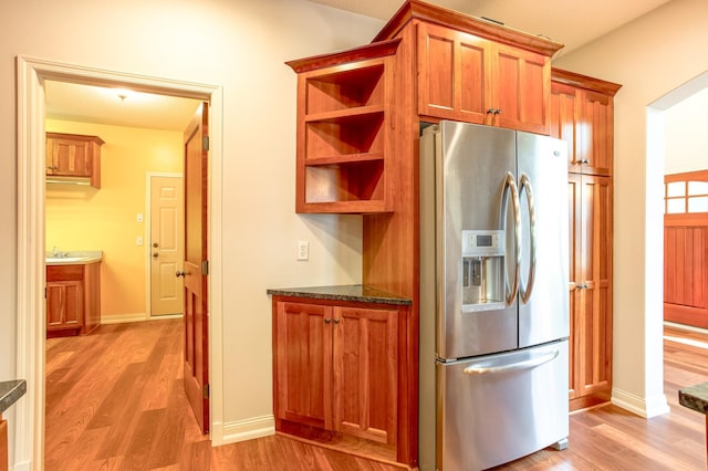 10725 Toledo Ln N, Brooklyn Park, MN 55443 - kitchen featuring stainless steel refrigerator with ice dispenser, light wood-style flooring, and brown cabinetry